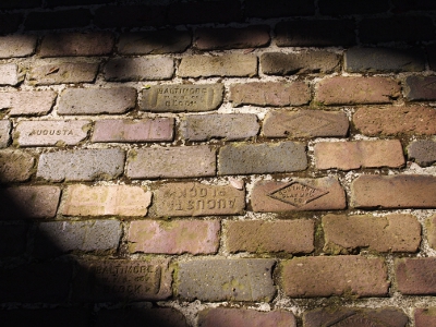 [Closeup of bricks. Bricks stamped with 